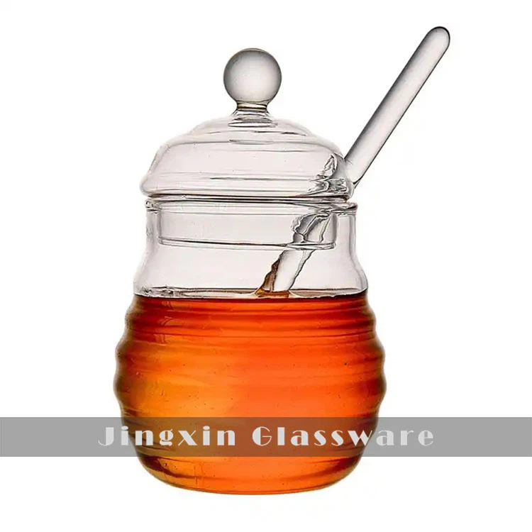 Glass honningkrukke og dipper